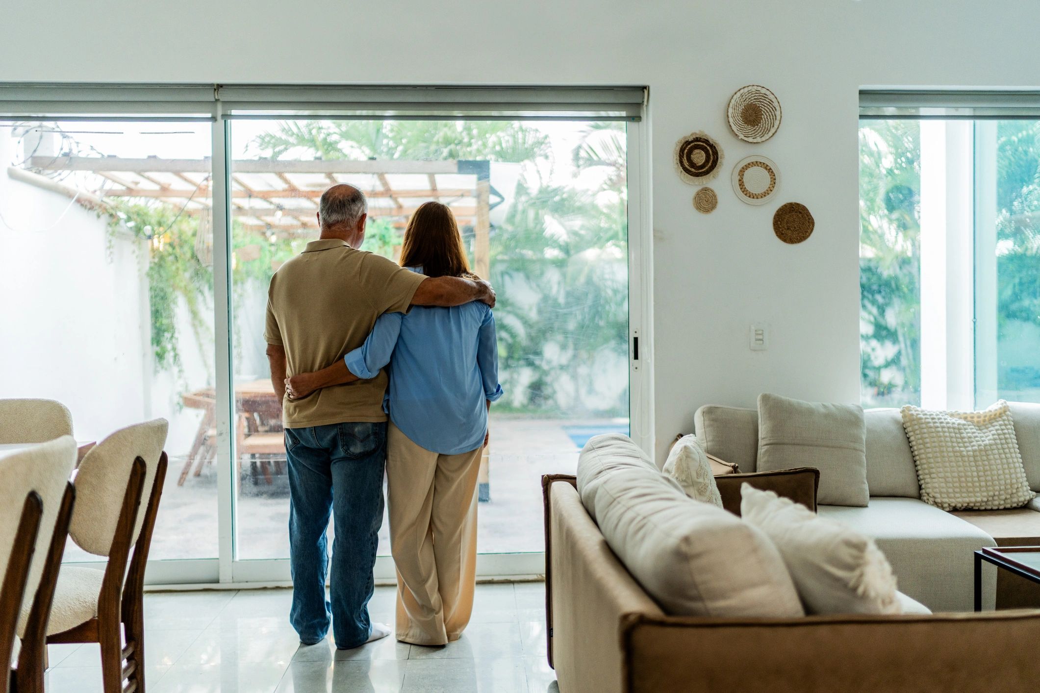Couple at home looking ahead together